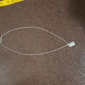 Effy Silvertone long necklace: Charm shopping at sea w/ blue stone, claw clasp.